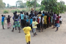 Meanwhile Lisa did child evangelism with the children from the village under the tree, African style!