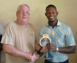 Phil Edwards from the Living Room distributing the Luci Solar Lights dontated 
 by Sandy Lane Hotel in Barbados.