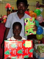 Seen here one of your boxes being delivered to a child in Les Martineur Church of God.