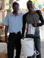 Pastor Pierre Banes Laurore, the Kids' EE Haiti Director seen here in YWAM in Gonaive documenting the Sawyer PointONE water filter distribution.