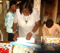 Black Bess New Testament Church of God pack Make Jesus Smile shoeboxes for children in Haiti