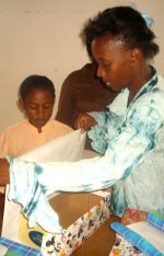 Black Bess New Testament Church of God pack Make Jesus Smile shoeboxes for children in Haiti