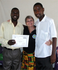Pastor David, right Jenny and and Pastor Mango, left the Uliwa KIMI teacher receiving his KIMI certificate
