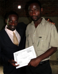 Seen here with Pastor David receiving his KIMI certificate at the KIMI Leadership Training in Uluwa in Malawi.