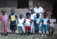 Teacher Steria Chawawa with standard 2 pupil orphans at the  Chisomo Christian Orphan school