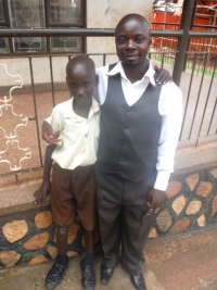 Jonathan seen here with his new dad - Pastor Abraham on his first day at school - praise God.