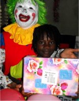 Annie the clown distributing Make Jesus Smile shoeboxes