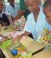 Half Moon Primary School children in Barbados with their boxes packed ready for shipping to Haiti