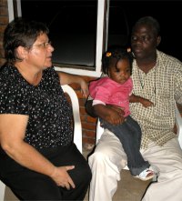 Aiapra sitting with Pastor Iwan and Kim after the party
