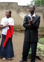 Pastor David with his wife Stella outside the church in Mbeya.