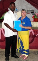 KIMI training in Mbeya Pastor David receiving his KIMI manual 