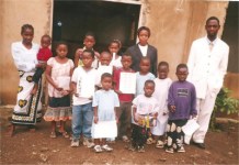 Pastor Lotie, Stella and the Sunday School teacher with some of the children