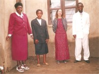 Pastor Lotie seen here In the white suit with one of the new church member Sister Karin (she is from Germany,) in black suit is Stella, his wife, followed by one of the church member.