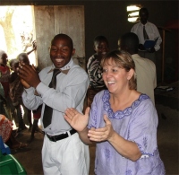 Pastor Laura seen here in the middle with her translator