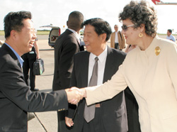 ermanent Secretary in the Ministry of Foreign Affairs and Trade, Teresa Marshall (right) and the Chinese Ambassador to Barbados, Zhikuan Yang (centre), greet the Vice Chair of the China Council for the Promotion of International Trade, Yu Ping, as he disembarked his flight yesterday at the Grantley Adams International Airport. 