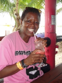 Dr. Brenda Caldwell, affectionately known as “Dr. B” enjoying a fruit punch  in Barbados