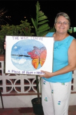 Dr B then presented The WISH Centre with a beautiful painting of the logo which she painted herself 