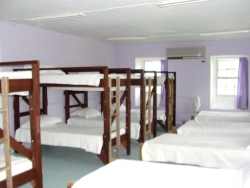 The south east facing bedroom was once the master bedroom and is an enormous room with 4 bunks and 5 single beds.