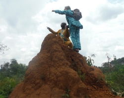 Seen here Rev Abraham and Jenny up a ant hill on Hope Estate!