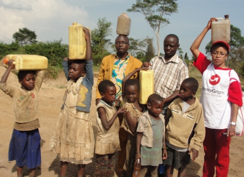 Children walk for miles to the Land Sand Mining borehole