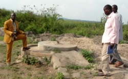 Children from the village walk for miles to collect water on the Land Sand Mining bore hole.