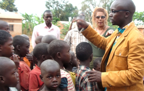 Rev Abraham Kisembo and Lisa at the Village Committee