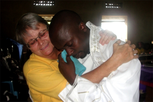 Rev Abrahams commissioning with Jenny at Nyangrongo Full Gospel Pastors seminar child evangelism and Moringa Community Project training