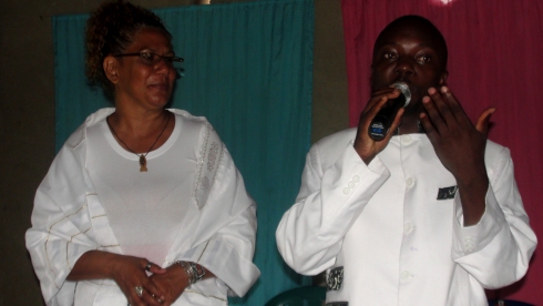 Rev Abraham Kisembo and Lisa on the mountain