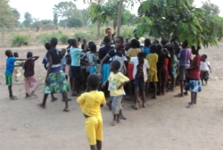 Meanwhile Lisa did child evangelism with the children from the village under the tree, African style!
