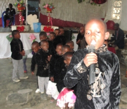 Seen here Joshua, Bishope David's son singing and praising God.