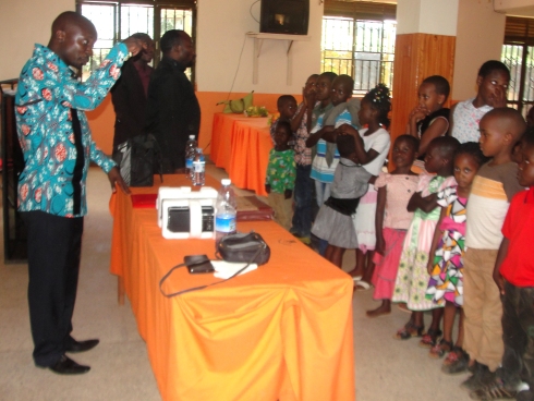 Rev Abraham Kisembo founder of Faith Power Pentecostal Ministries - Uganda at church