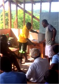 Seen here the team in Jacmel going through a demonstration of how to assemble to filters.