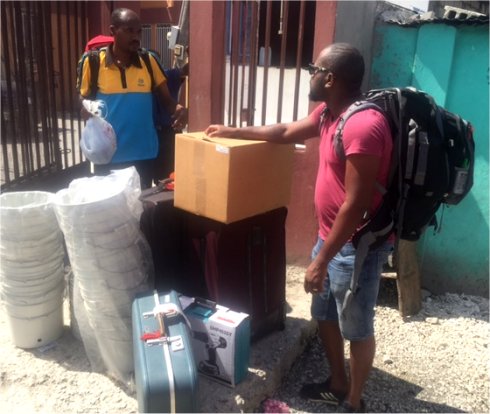 United Caribbean Trust Mission trip to help survivors of Hurricane Matthew in Haiti with Sawyer filtered clean water as fears of an increase in cholera cases grow