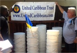 Seen here our team setting up prior to the distribution that took place in a Methodist church in Jeremie that had loss its roof in hurricane Matthew.