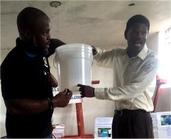 Seen here Pastor Banes and Nigel teaching the Pastors and teachers how to assemble the community filters.