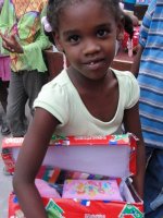 The Make Jesus Smile shoebox distribution took place outdoors at the Church of God school in Les Cayes.