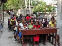 The Make Jesus Smile shoebox distribution took place outdoors at the Church of God school in Les Cayes.