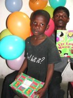 At last Pastor Banes was able to deliver the Make Jesus Smile shoeboxes to the children at his church.