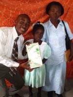 Daniel Noel distributed Make Jesus Smile shoeboxes at the Nazarene church in Goniave on Sunday morning.