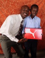 Daniel Noel distributed Make Jesus Smile shoeboxes at the Nazarene church in Goniave on Sunday morning.