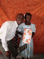 Daniel Noel distributed Make Jesus Smile shoeboxes at the Nazarene church in Goniave on Sunday morning.