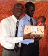 Daniel Noel distributed Make Jesus Smile shoeboxes at the Nazarene church in Goniave on Sunday morning.