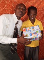 Daniel Noel distributed Make Jesus Smile shoeboxes at the Nazarene church in Goniave on Sunday morning.