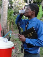 Just to prove the Sawyer Point One Filter is the fastest, easiest and most cost efficient way to get potable water Pastor Banes took the first drink.