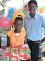 Kids' EE Haiti director distributing Make Jesus Smile shoeboxes