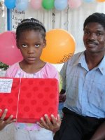 Kids' EE Haiti director distributing Make Jesus Smile shoeboxes