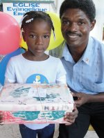 Kids' EE Haiti director distributing Make Jesus Smile shoeboxes