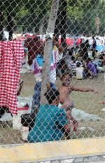 Most people in Port au Prince continue to sleep under tents, tarps or sheets.