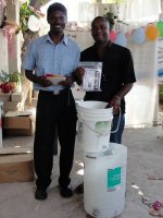 Pastor Pierre Banes Laurore, the Kids' EE Haiti Director seen here in YWAM in Gonaive documenting the Sawyer PointONE water filter distribution.