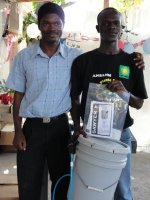 Pastor Pierre Banes Laurore, the Kids' EE Haiti Director seen here in YWAM in Gonaive documenting the Sawyer PointONE water filter distribution.